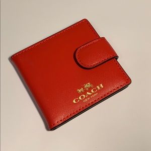 Coach bifold clutch mirror